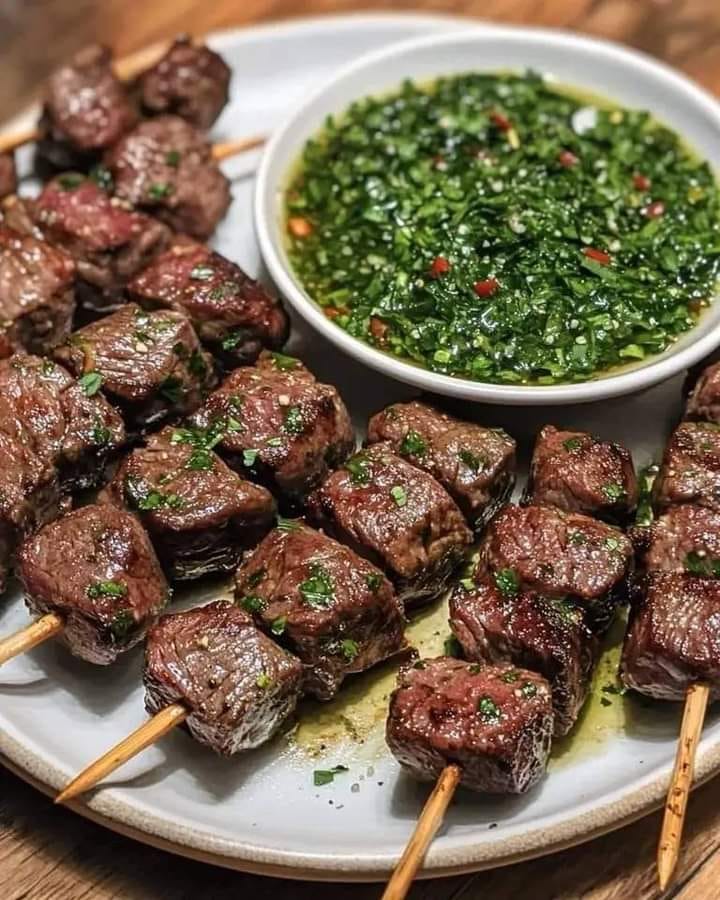 Spicy beef skewers with chimichurri sauce 